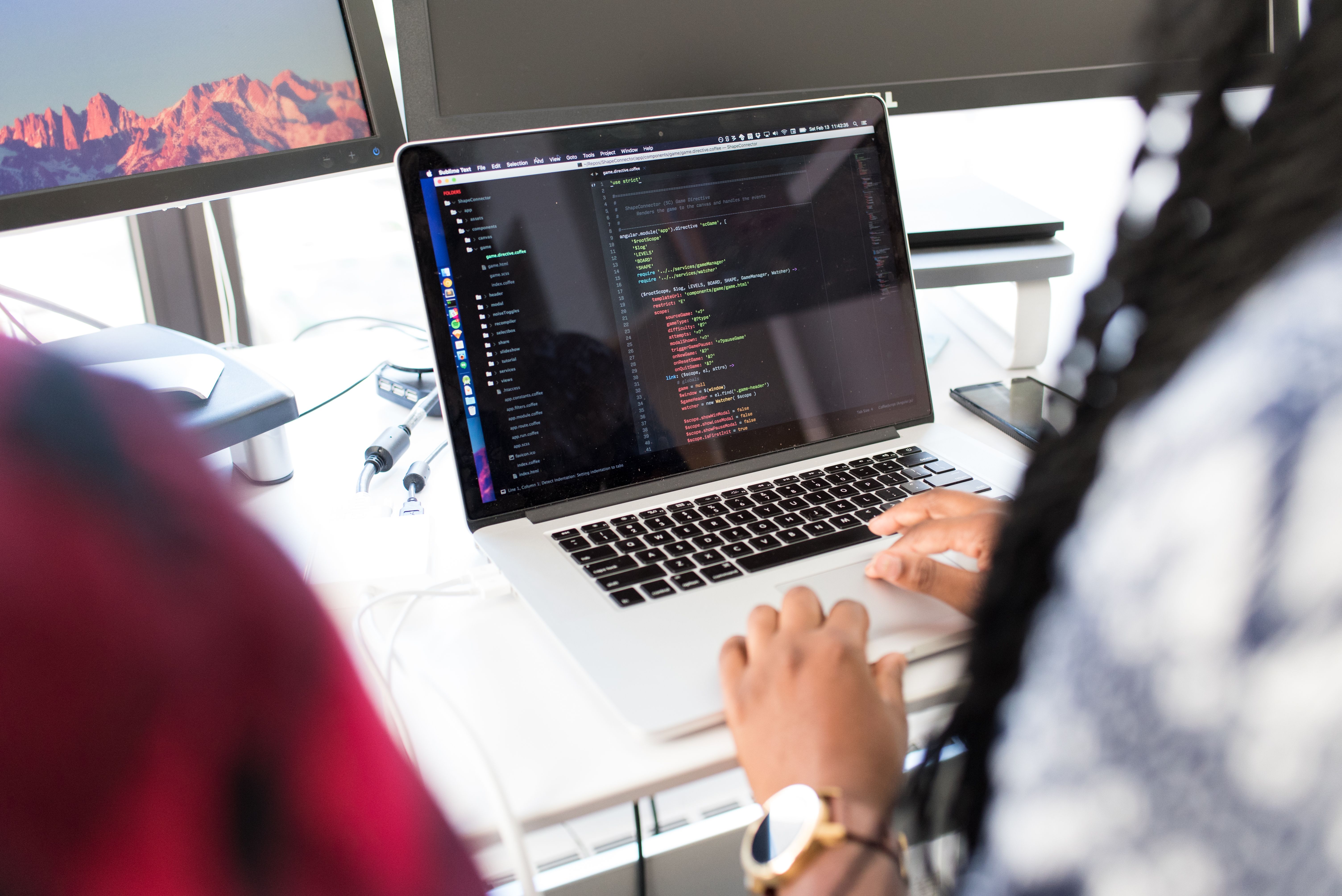Developer using an AI coding assistant inside a modern editor